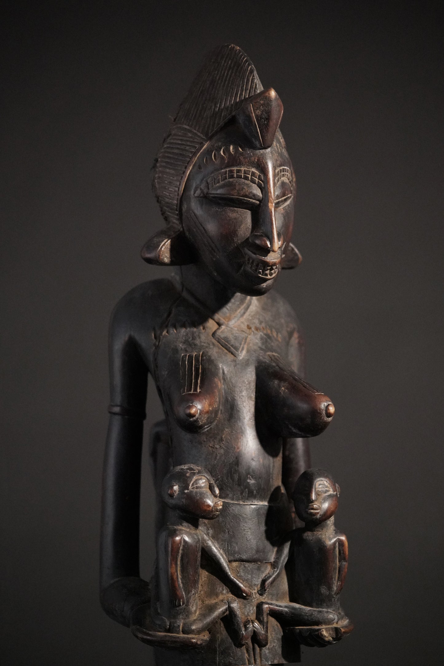 A remarkable seated Senufo maternity