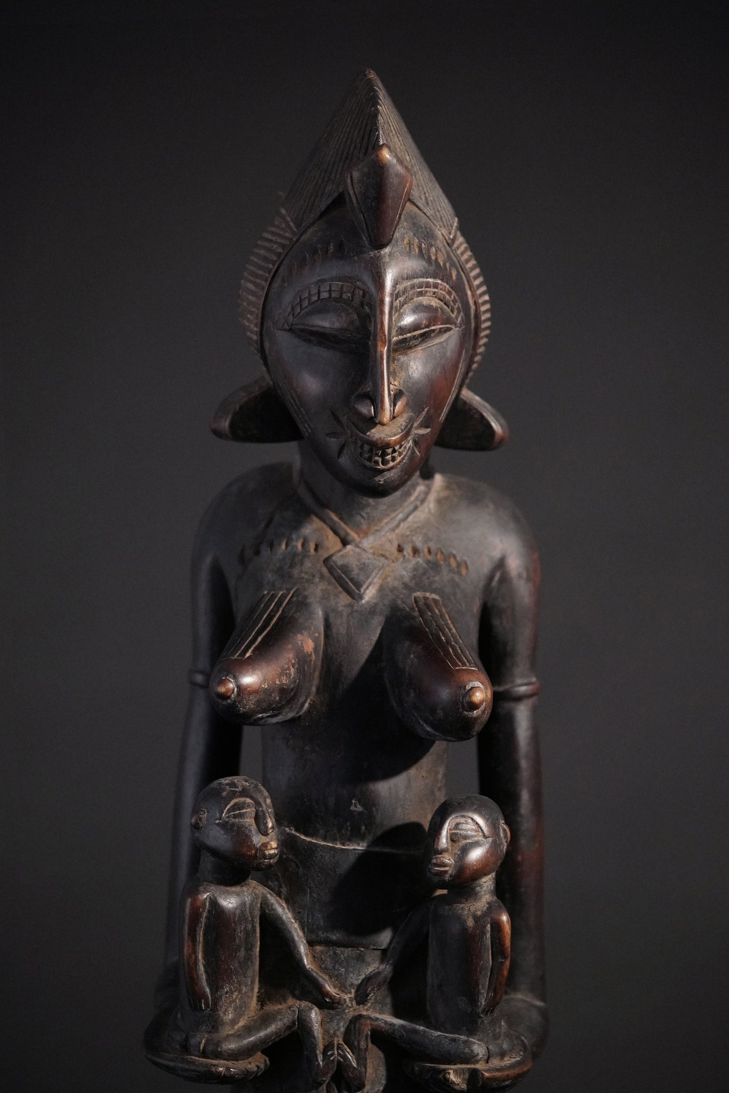 A remarkable seated Senufo maternity