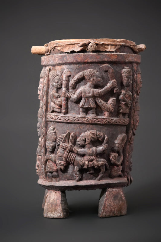 A round, one-piece standing drum on four legs