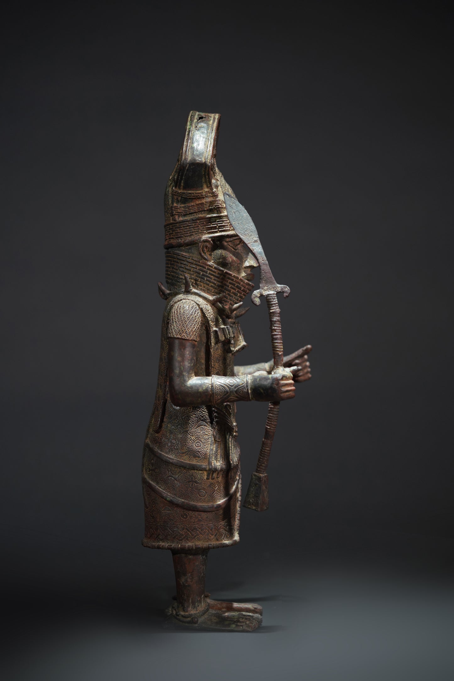 A Dignitary, brass, lost mould casting, Benin