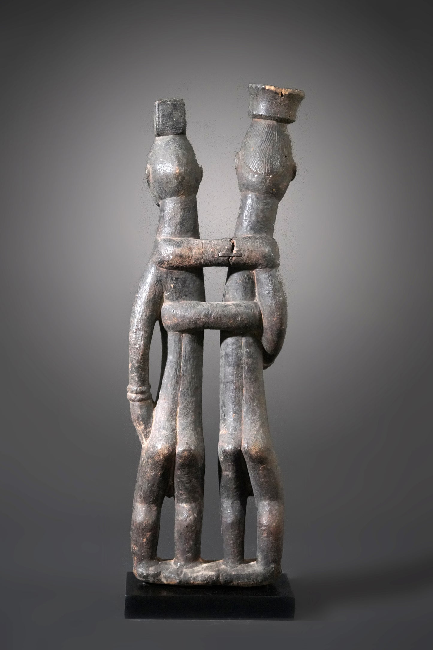 A Guro couple standing on one base