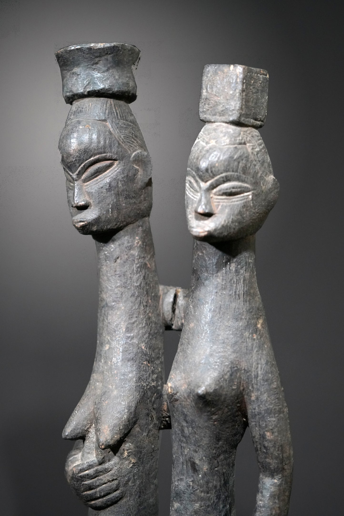 A Guro couple standing on one base