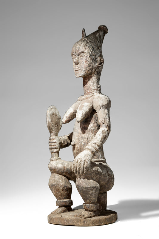 A very expressive female seated Urhobo sculpture