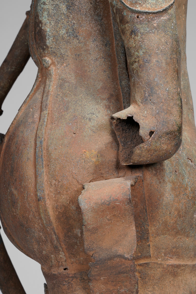 A fragmentary bronze sculpture