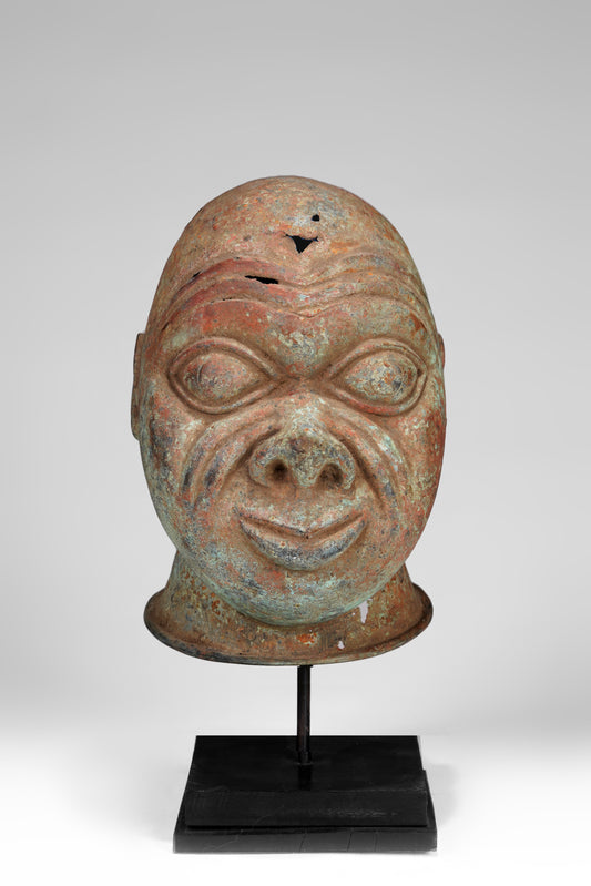 A bronze head in the style of Tada