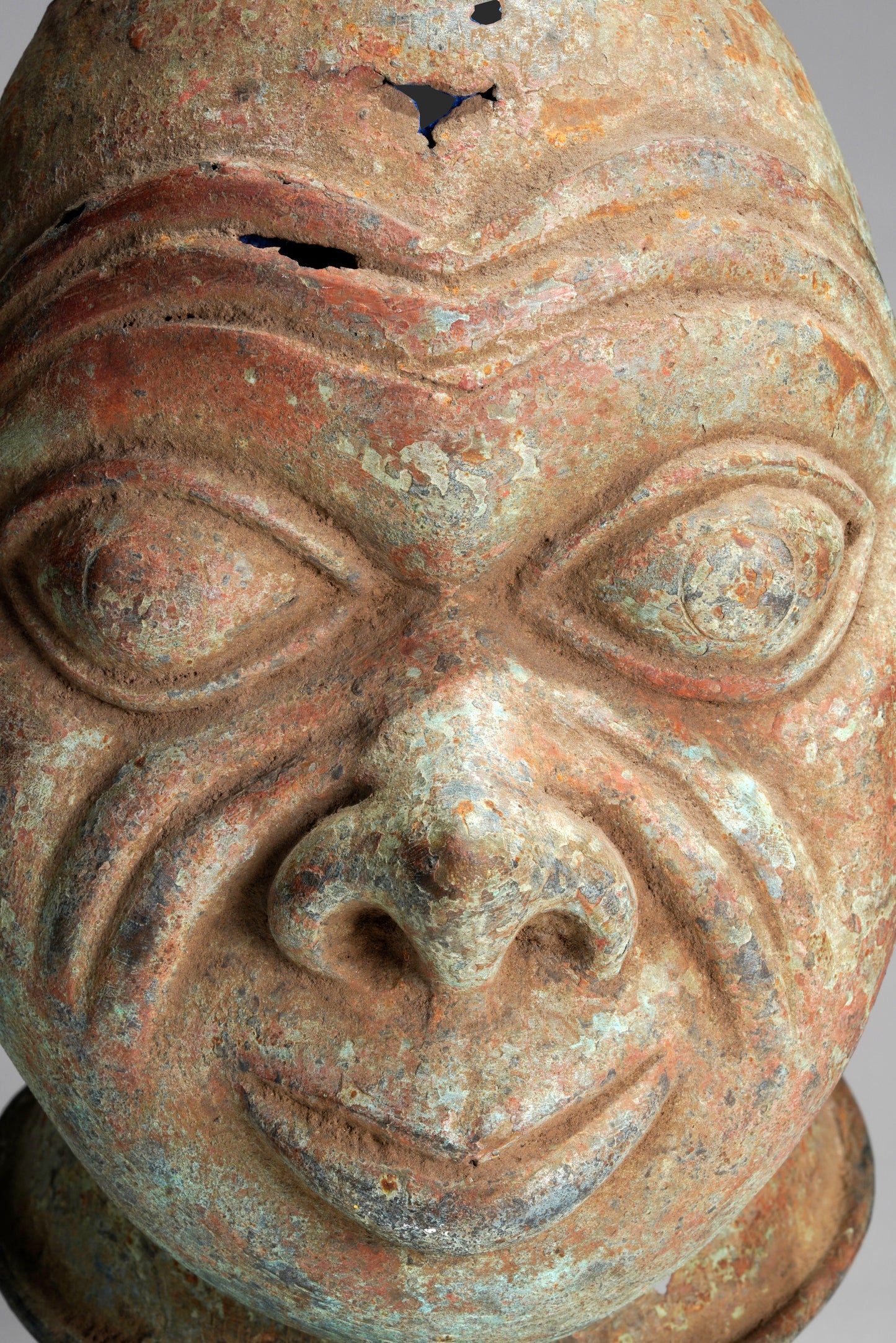 A bronze head in the style of Tada