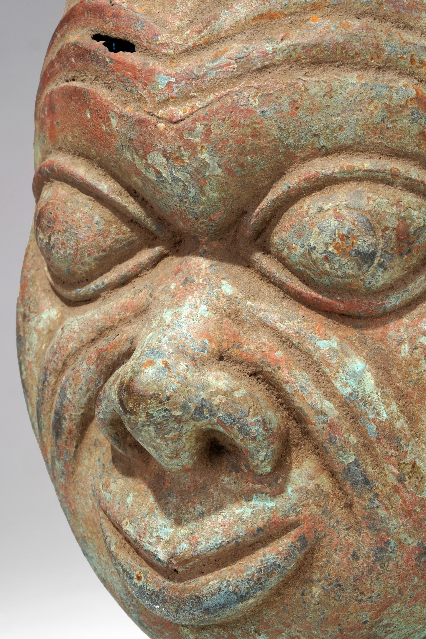 A bronze head in the style of Tada